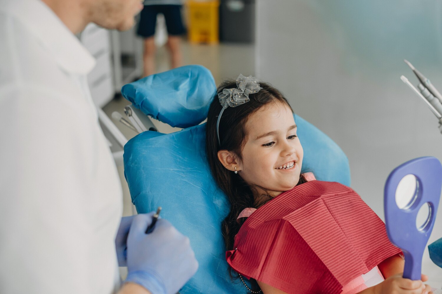 Cute Little Girl Looking Into Mirror While Sitting Stomatology Chair After Doing Teeth Surgery 129180 3677 Cute Little Girl Looking Into Mirror While Sitting Stomatology Chair After Doing Teeth Surgery 129180 3677