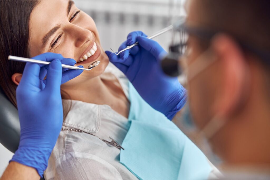 Cheerful Positive Dentist Client Dentistry Female Patient Dental Procedure Doctor Using Dental Instruments Modern Dental Clinic Close Up 341052 2826 Cheerful Positive Dentist Client Dentistry Female Patient Dental Procedure Doctor Using Dental Instruments Modern Dental Clinic Close Up 341052 2826