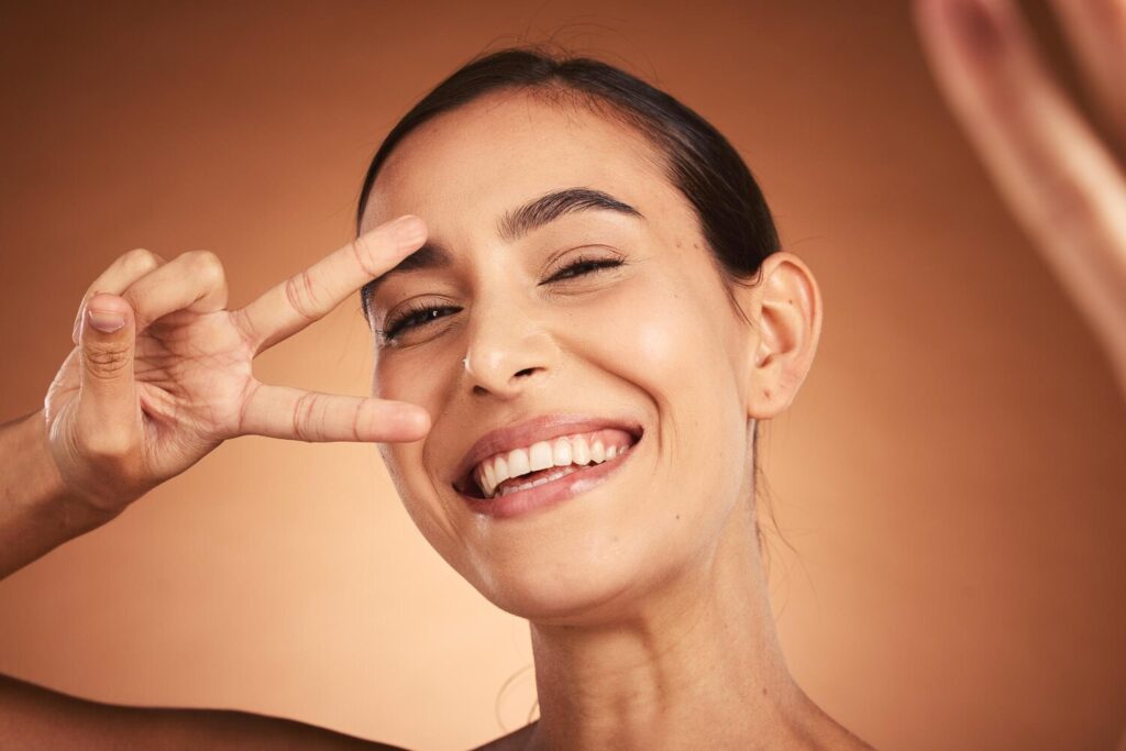 Face Peace Sign Woman Happiness Selfie Model With Funny Hand Sign Portrait Comic Hand Gesture Beauty Laughing Feeling Silly Happy About Youth With Smile Beautiful Skin 590464 110868 Face Peace Sign Woman Happiness Selfie Model With Funny Hand Sign Portrait Comic Hand Gesture Beauty Laughing Feeling Silly Happy About Youth With Smile Beautiful Skin 590464 110868